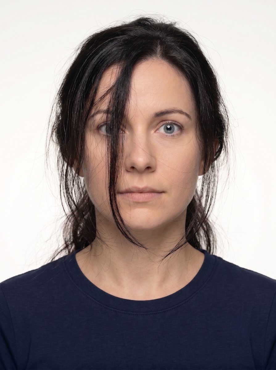 Rejected Brazil visa photo example — loose hair strands covering the eyes, eyebrows or part of the face. Brazil eVisa / VFS Global would reject this for visa applications.